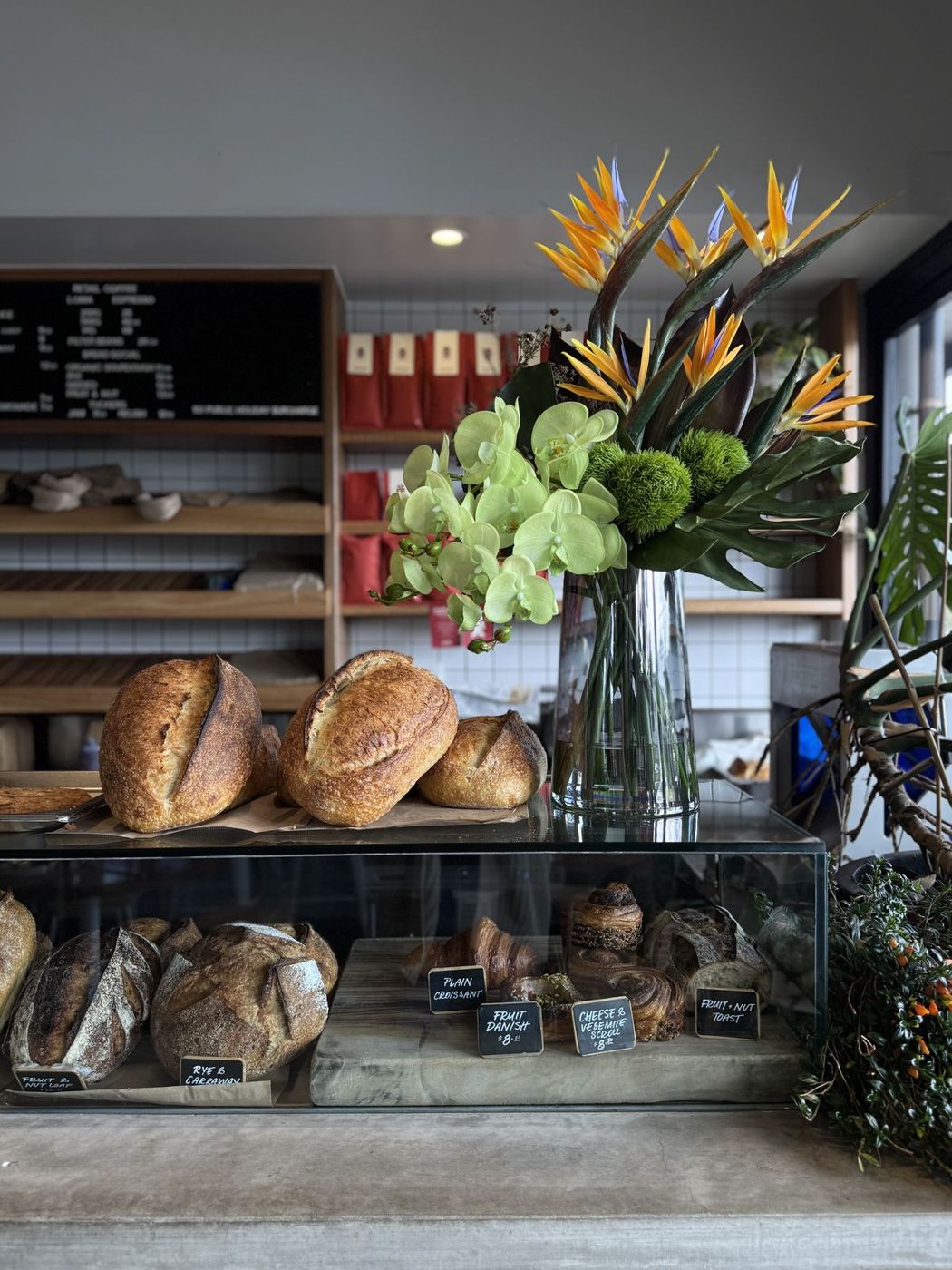 Sourdough and flowers on the front counter