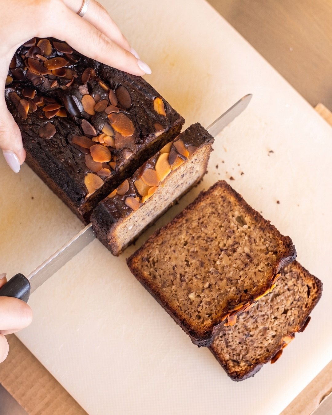 Banana bread loaf being sliced