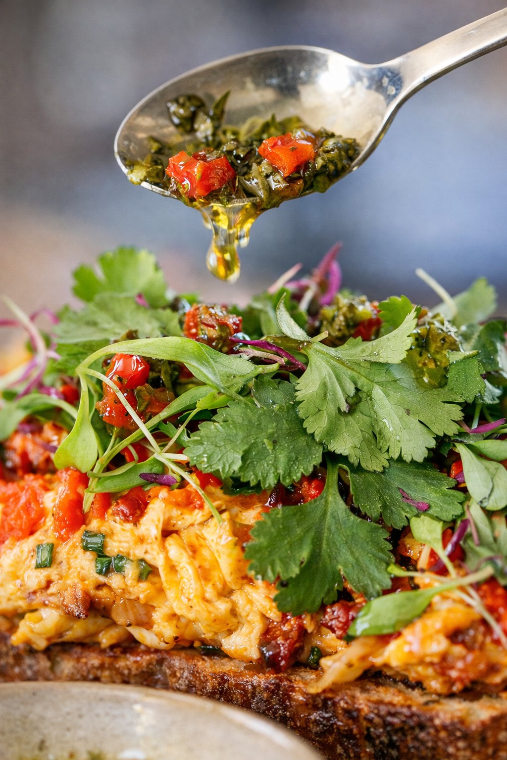 Chimichurri spooned over the chorizo scramble