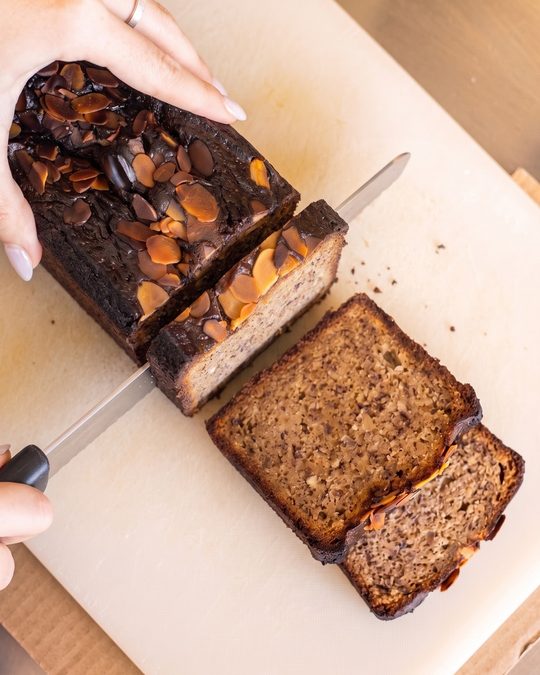 Banana bread being sliced