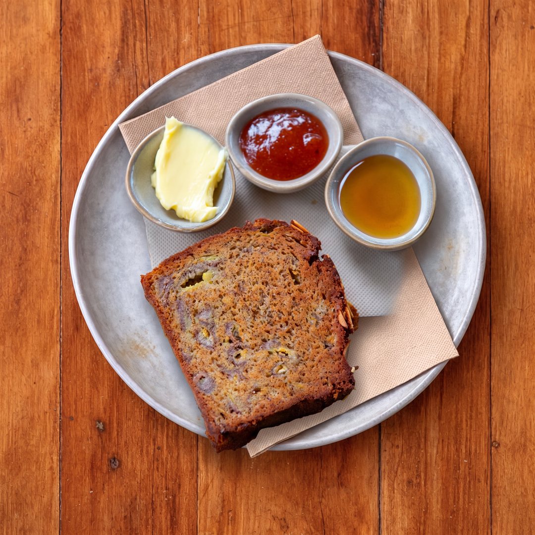Banana bread with butter, jam and honey